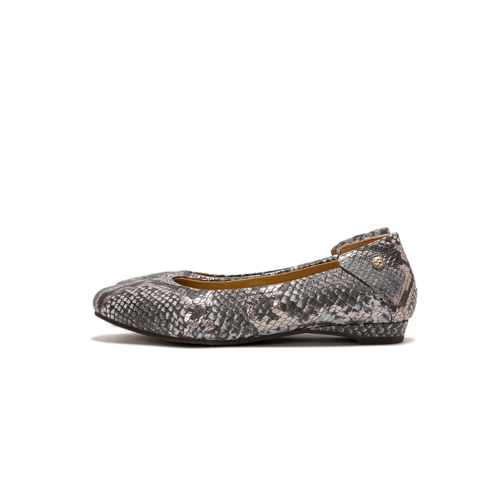 A single women's flat shoe with a gray and black snakeskin pattern, featuring a small gold-tone logo stud on the heel, shown against a plain white background.