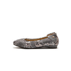 A single women's flat shoe with a gray and black snakeskin pattern, featuring a small gold-tone logo stud on the heel, shown against a plain white background.
