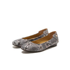 A pair of women's ballet flats featuring a gray and black snakeskin pattern, with a small gold button detail on the back of the heel, shown against a plain white background.