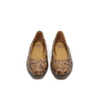 A pair of ballet flats with a brown and tan snakeskin pattern, shown from a top-down view on a white background.