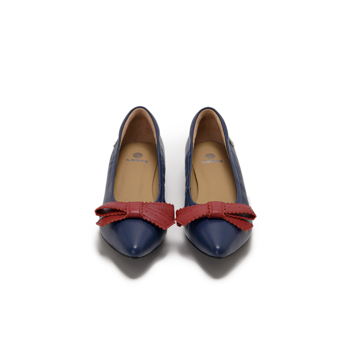 A pair of navy blue leather pointed-toe flats with a contrasting red leather bow detail on the vamp, lambskin, comfortable, stylish